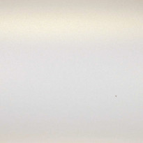 Carta Stardream Citrine Cordenons – dettaglio della superficie perlata bianco caldo con riflessi dorati cangianti